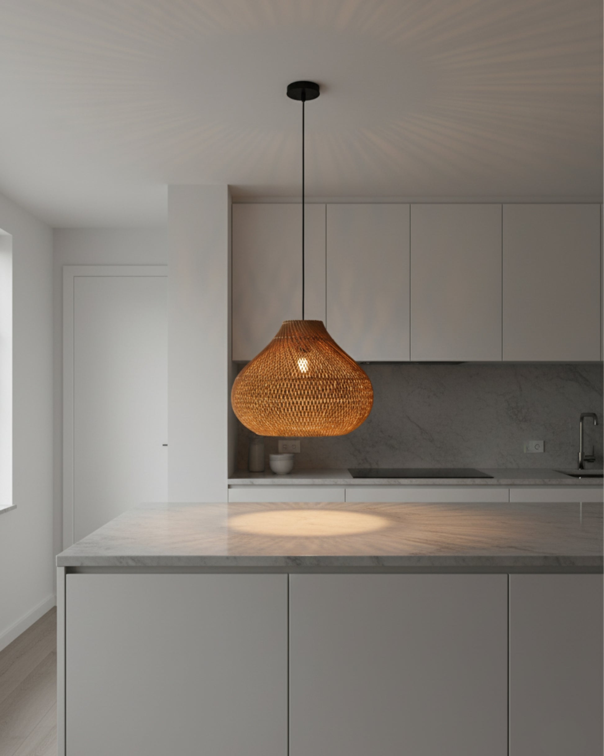 Gourd-shaped handwoven rattan pendant with black canopy, D40 cm (15.75”) × H33 cm (12.99”). Warm E27 glow forms a starburst on the ceiling and a soft pool on the marble island; ideal for kitchens and dining.