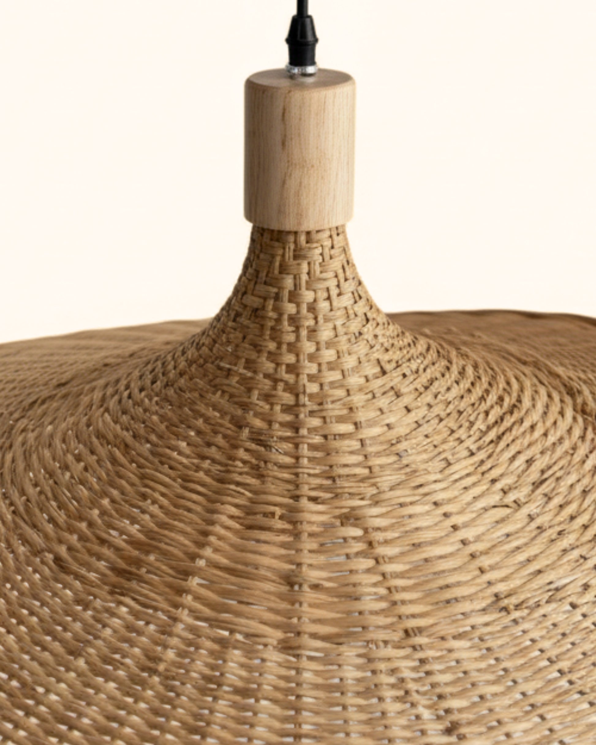 Close-up of the handwoven rattan pendant light at the neck—tight basket weave, smooth wood cap and black cord; sculptural wave shade detail; ideal for Japandi interiors; E27 LED compatible.